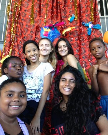 Six of EduMais's Summer Camp participants and one of their volunteer teachers looking happy