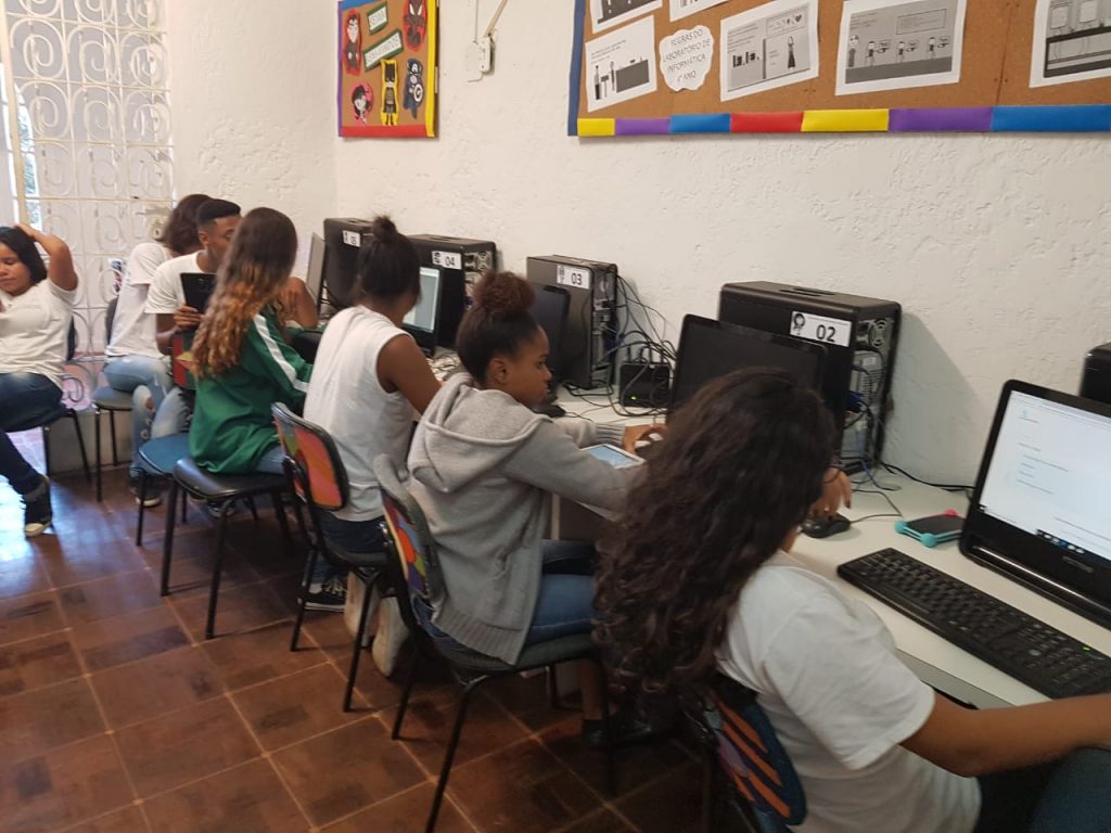 EduMais students work on their web design and computer skills in the IT room of Solar Meninos de Luz school