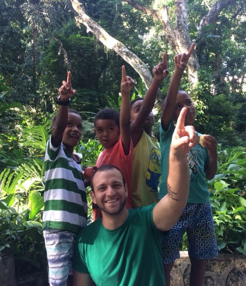 The four boys on our after-school program and volunteer Gabriele point to a monkey in the trees in Parque Lage, Rio de Janeiro