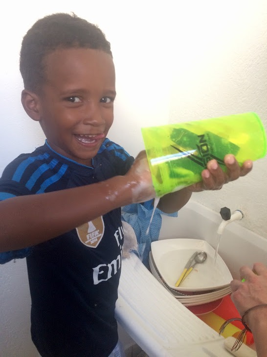 After School - kid helping cleaning dishes