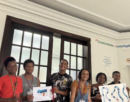 6 kids presenting their board games. Smiling faces