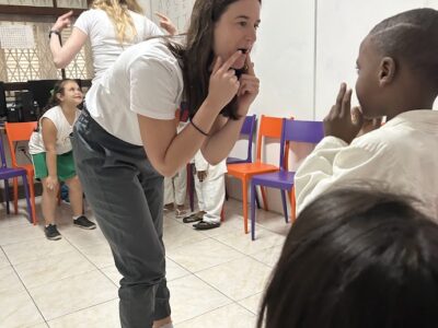 Chloe example Woman in classroom giving an example