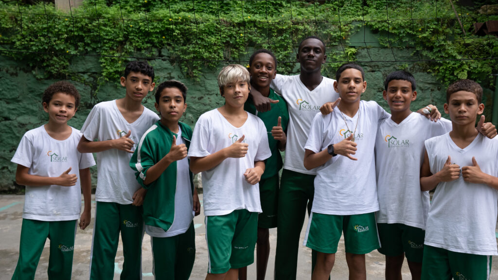 group of boys with thumbs up