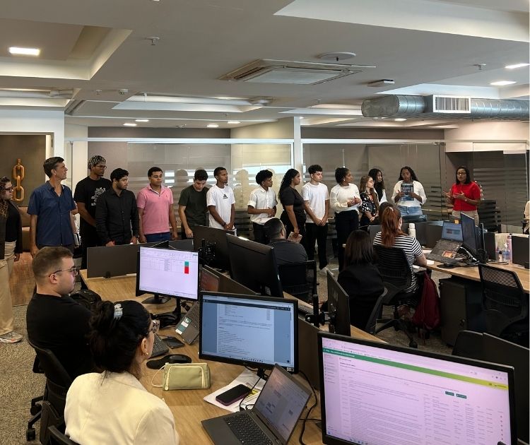 People in the office working behind the computers.