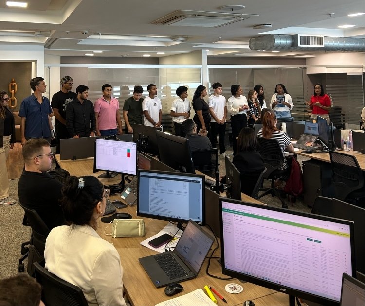 group of people in the office working at their desks
