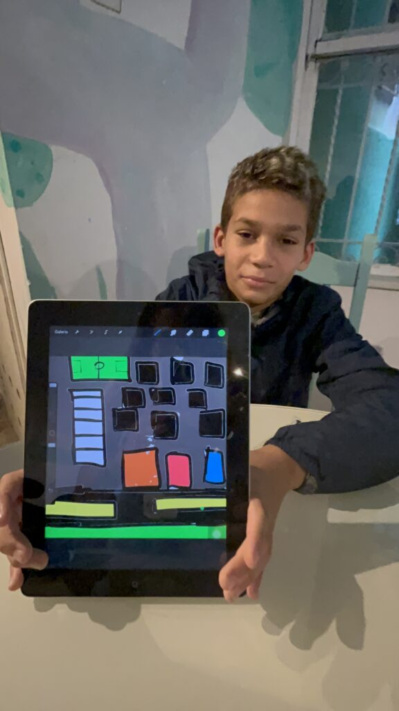 Volunteer Serious Game Design in Rio – student creating animation with Procreate
