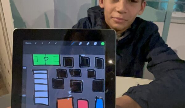 Volunteer Serious Game Design in Rio – student creating animation with Procreate