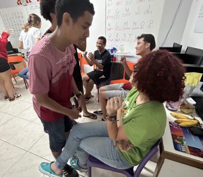 Cooperation People sitting and some people standing