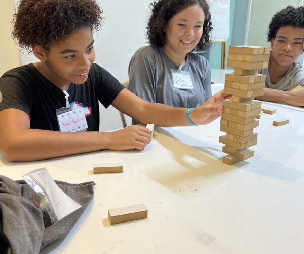 teenagers playing with blocs