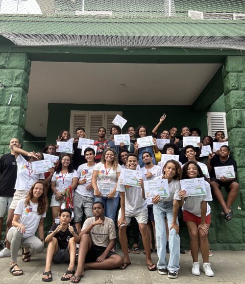 many kids with certificates in their hands and smiling faces